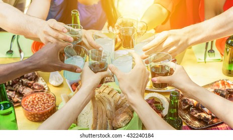 Group Of Friends Toasting With Aperitif Eating Barbecue Outdoor - Closeup Of Hands Cheering With Cocktails And Beers - Friendship,summer,fun And Dinner Concept - Warm Filtered Look