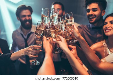 Group of friends toasting with champagne - Powered by Shutterstock