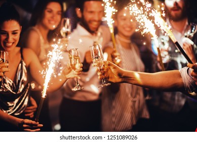 Group of friends toasting in the club - Powered by Shutterstock