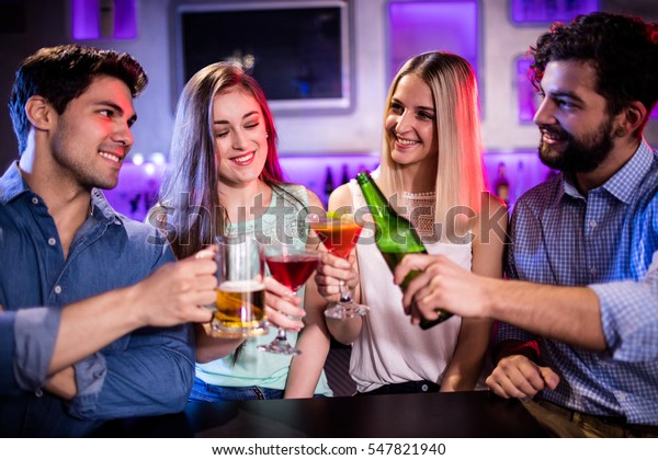 Group Friends Toasting Cocktail Beer Bottle Stock Photo 547821940 ...