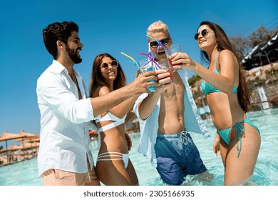 Group of friends together enjoying party, cocktails on summer vacation. People travel fun concept. - Powered by Shutterstock