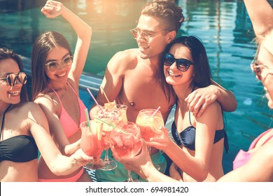 Group of friends together in the swimming pool leisure - Powered by Shutterstock