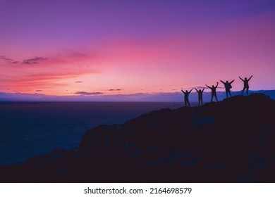 Group Friends tourists stay mountain top and looking sunset. Concept travel trip friendship. - Powered by Shutterstock