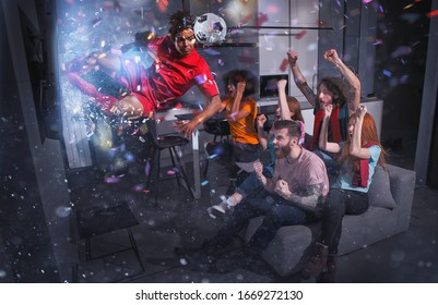 Group Of Friends Watch A Football Match On Television With A Soccer Player Who Exits From Screen