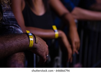 Group of friends watching a rock concert in nightclub - Powered by Shutterstock