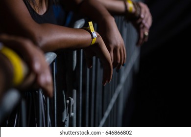 Group of friends watching a rock concert in club - Powered by Shutterstock