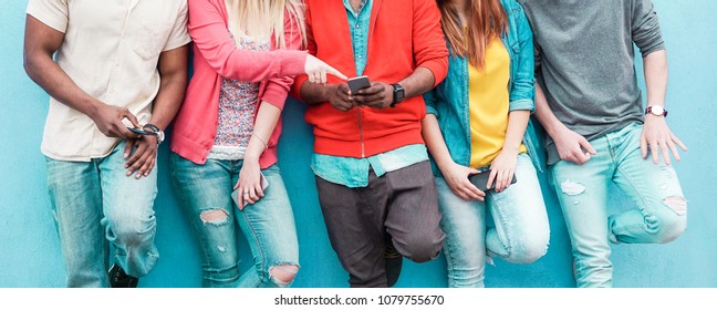 Group Of Friends Watching Smart Mobile Phone - Teenagers Addiction To New Technology Trends - Youth Lifestyle, Tech, Social, Millennial Generation And Friendship Concept - Main Focus On Center Hands