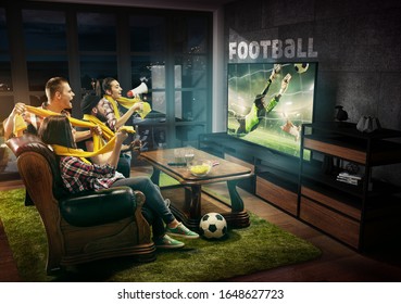 Group of friends watching TV, football match, championship, sport games. Emotional men and women cheering for favourite team, look on goalkeeper's jump. Concept of friendship, competition, emotions. - Powered by Shutterstock