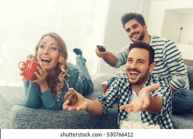 Group Of Friends Watching TV Match And Having Fun Together.