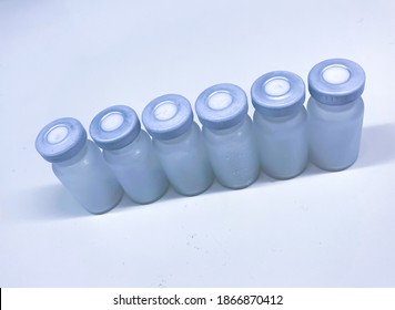 Group Of Frosted Vials With Crimp Caps Taken Out From A Container With Dry Ice After Professional, Medical Transport. Selected Focus.