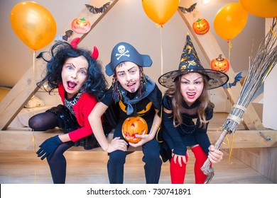 group of funny  children in costume celebrate together a halloween party - Shutterstock ID 730741891