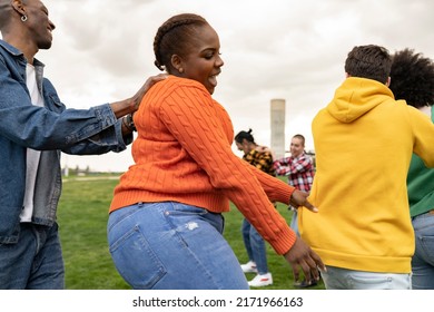 Group Of Funny Friends Dancing Outside, Focus On Curvy Woman