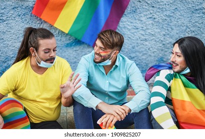 Group Of Gay Men Wearing Surgical Face Masks Under Chin And Enjoy The LGBT Pride Parade Together - Concept Of Transgender And Homosexual