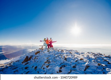 Group Of Girlfriends Have Fun In Winter On Top Of Mountain. Copy Space