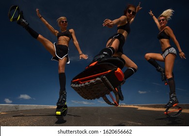 Group of girls doing exercises in kangoo jumping boots