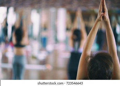 Group of girls to exercise, yoga in the studio