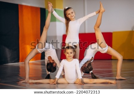 Group of girls exercising at gymnastic school