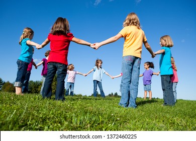 Group of Girls Holding Hands in a Circle Outside - Unity, Friendship