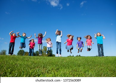 Group of Girls Jumping Together Outside - Unity, Friendship