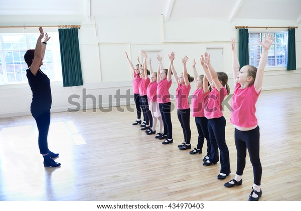 Group Of Girls\
In Tap Dancing Class With\
Teacher
