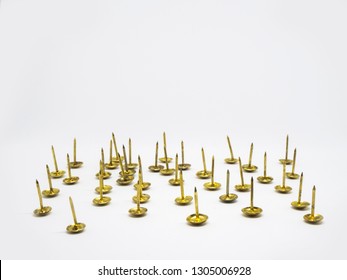 Group Of Gold Metal Thumb Tack On Isolated White Background