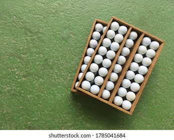 Group Of Golf Ball In Custom Wood Box Tray Stacking In Tilt Angle Top View