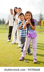 Group Of Golf Players Smiling At The Course