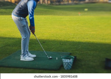 Group Of Golfers Practicing And Training Golf Swing On Driving Range Practice, Men Playing On Golf Course, Golf Ball At Golfing Complex Club Resort 