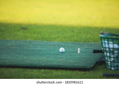 Group Of Golfers Practicing And Training Golf Swing On Driving Range Practice, Men Playing On Golf Course, Golf Ball At Golfing Complex Club Resort 