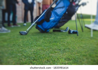 Group Of Golfers Practicing And Training Golf Swing On Driving Range Practice, Men Playing On Golf Course, Golf Ball At Golfing Complex Club Resort 