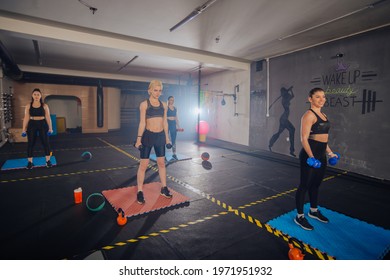 Group Of Good-looking Sportswomen Training Total Body Fitness Indoors