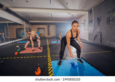 Group Of Good-looking Sportswomen Training Total Body Fitness Indoors