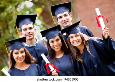 Group Of Graduate Students Holding Their Diploma After Graduation