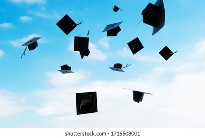 Group Of Graduation Caps Thrown In The Air.