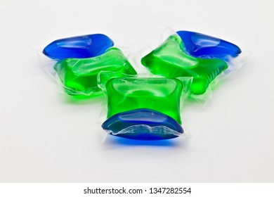 Group Of Green And Blue Laundry Detergent Pods Isolated On White Limbo Background