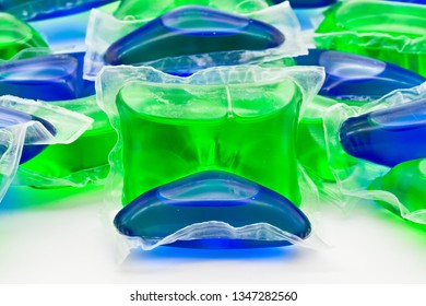 Group Of Green And Blue Laundry Detergent Pods Isolated On White Limbo Background