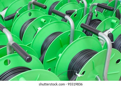 Group Of Green Cable Reels For New Fiber Optic Installation