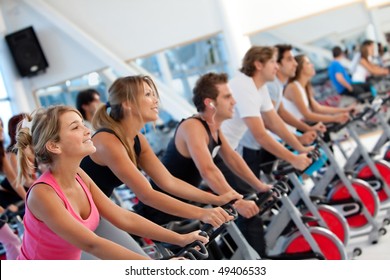 Group of gym people on machines