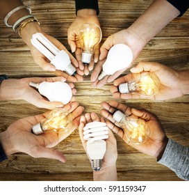 Group of hands holding creativity ideas light bulb sharing in aerial view - Shutterstock ID 591159347