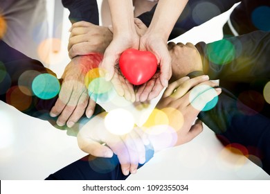 Group Of Hands Holding Red Heart, Health Care, Love, Organ Donation, Family Insurance And CSR Concept