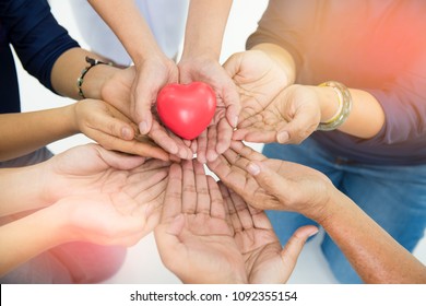 Group Of Hands Holding Red Heart, Health Care, Love, Organ Donation, Family Insurance And CSR Concept