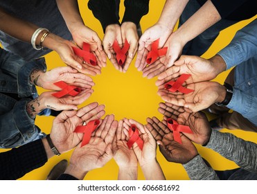 Group Of Hands Holding Red Ribbon Stop Drugs And HIV/AIDS Awareness