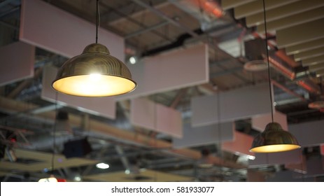 A group of hanging lights with shallow depth of field.