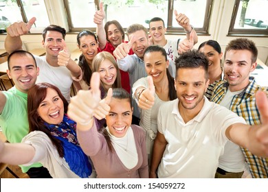 Group Of Happiness Students With Raised Hands