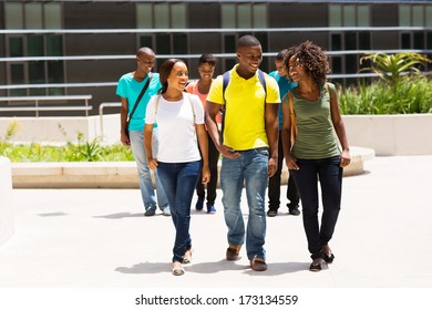 Group Of Happy African American College Students Walking On Modern Campus