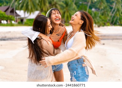 Group of Happy Asian woman enjoy and fun outdoor lifestyle travel nature ocean on summer beach holiday vacation. Attractive girl friends walking and playing together at the sea on tropical island. - Powered by Shutterstock