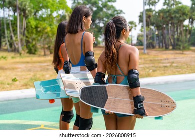 Group Of Happy Asian Woman Girl Friends Carry Skateboard Walking With Talking Together At Skateboard Park. Female Friendship Enjoy Outdoor Activity Lifestyle Play Extreme Sport Surf Skate Together