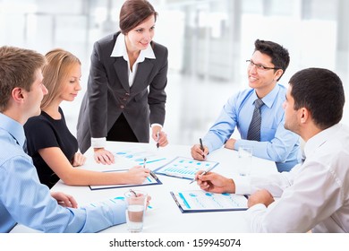 Group of happy business people in a meeting at office