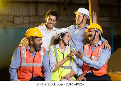 Group Of Happy Cheerful Indian Engineers Or Construction Workers At Industrial Factory Having Fun Laughing In Break Time, Team Work, Skill India Concept. 