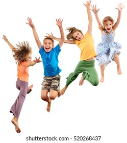 Group Of Happy Cheerful Sportive Barefoot Children Kids Jumping And Dancing. Kids Group Portrait Isolated Over White Background. Childhood, Freedom, Happiness, Dance, Movement, Action, Sport Concept.